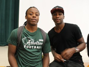 Homewood Center student Dre Fleeks, who had a copy of Buck autographed for him, with the author, M.K. Asante.